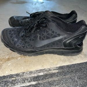 All black Nike shoes